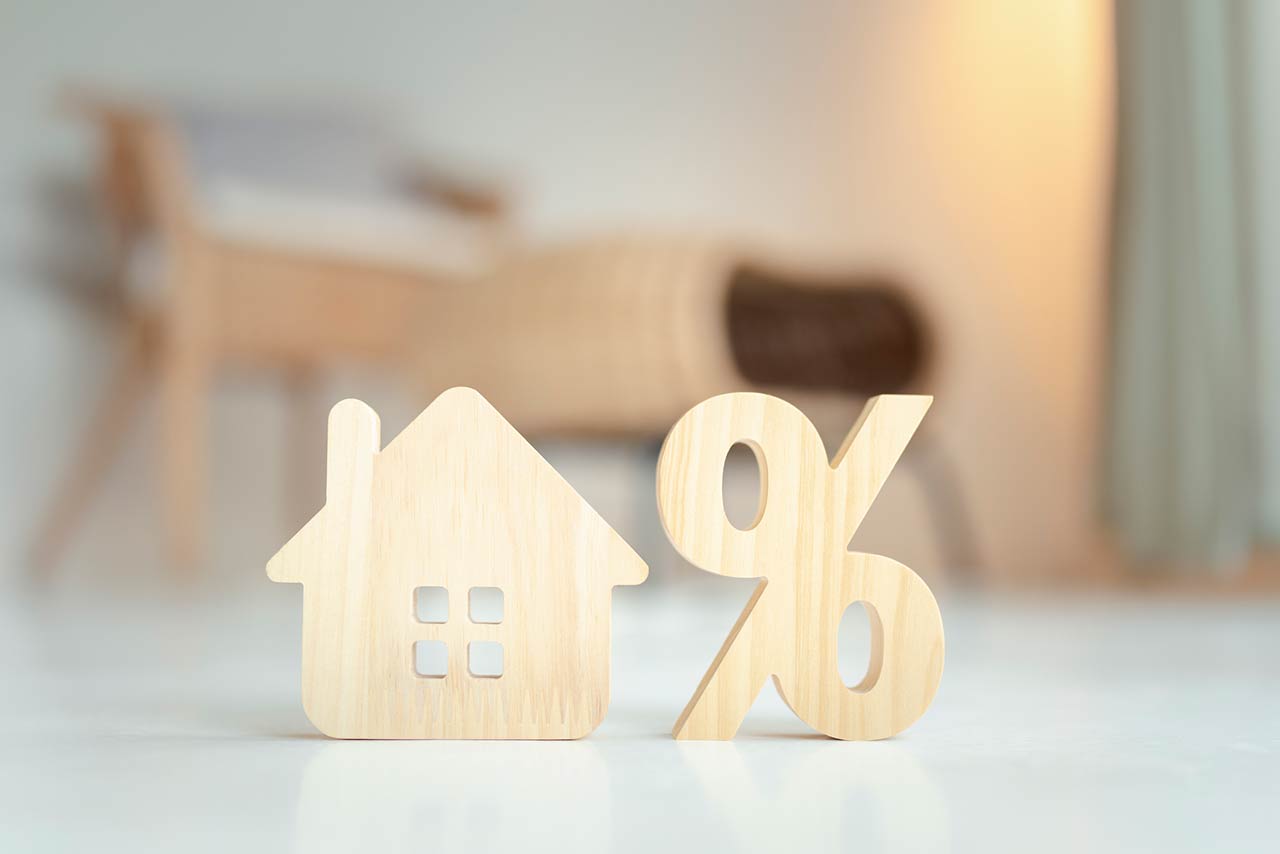 Percentage and house sign symbol icon wooden on wood table